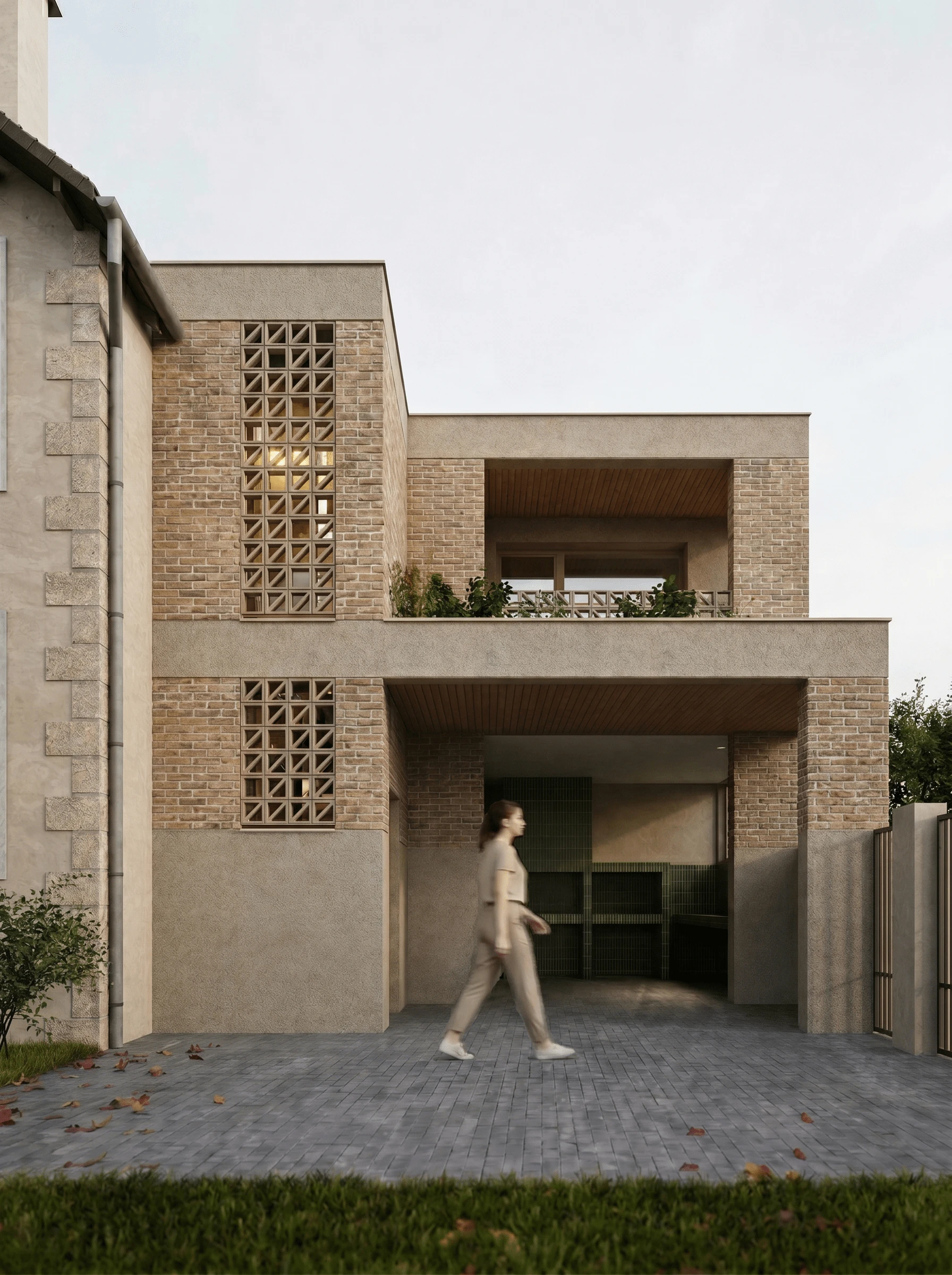 Volume en brique d’angle, loggia et moucharabieh